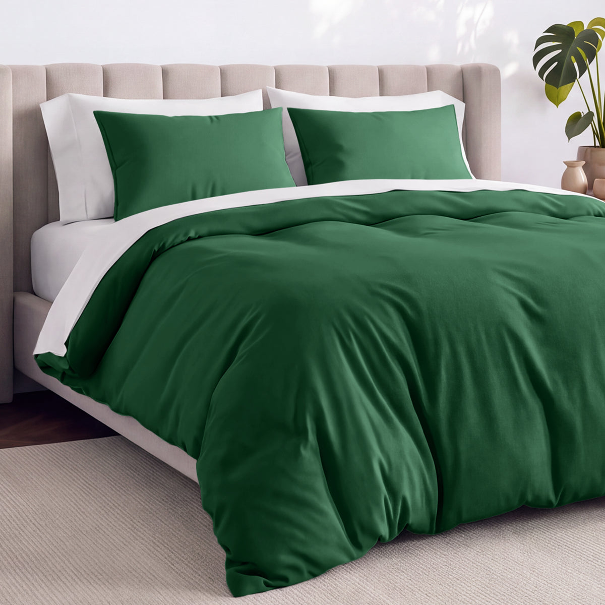 Bed with jersey duvet set against a beige headboard.