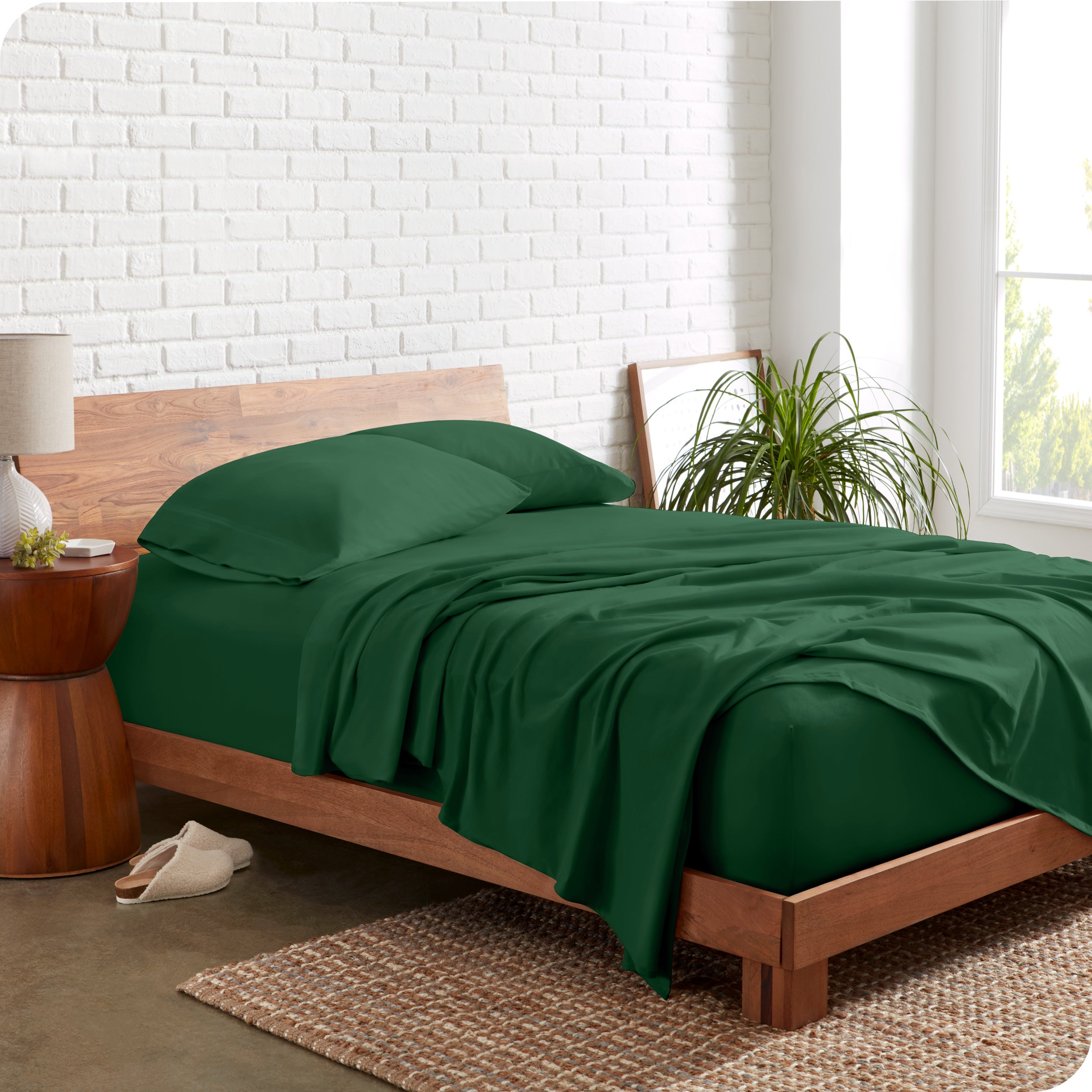 The side view of a bed made with organic cotton jersey sheets