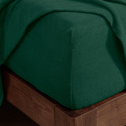 Corner of a mattress with a fitted sheet on it