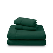 Polar fleece sheets and pillowcases folded and stacked on a white background