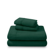 Polar fleece sheets and pillowcases folded and stacked on a white background