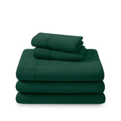 Polar fleece sheets and pillowcases folded and stacked on a white background