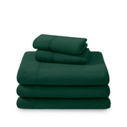 Polar fleece sheets and pillowcases folded and stacked on a white background