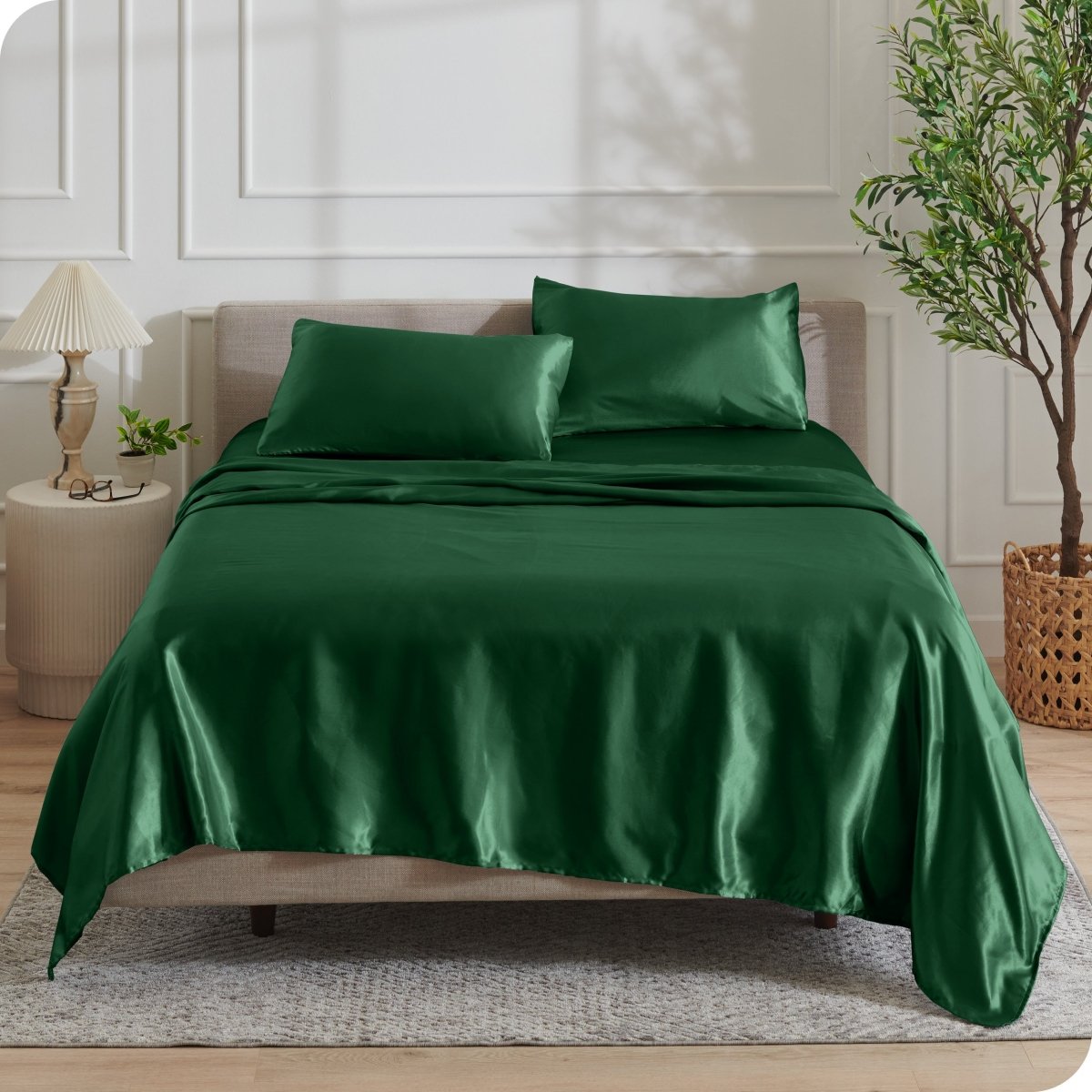 Satin sheets draped over a mattress