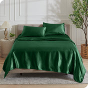 Satin sheets draped over a mattress