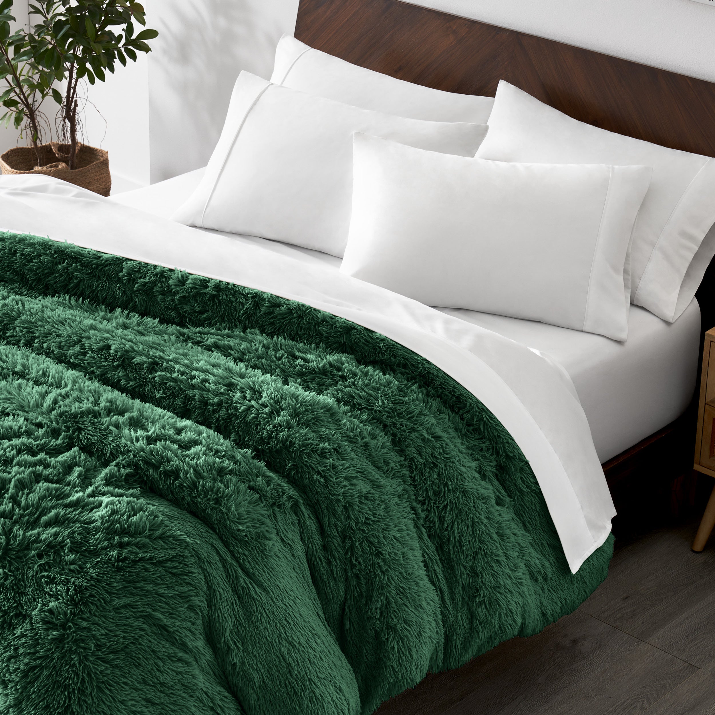 Shaggy duvet cover on a bed with white pillows and a wooden headboard.