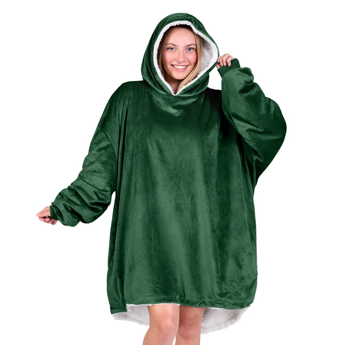 An adult with a hooded wearable blanket on