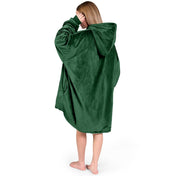 An adult with a sherpa wearable blanket on