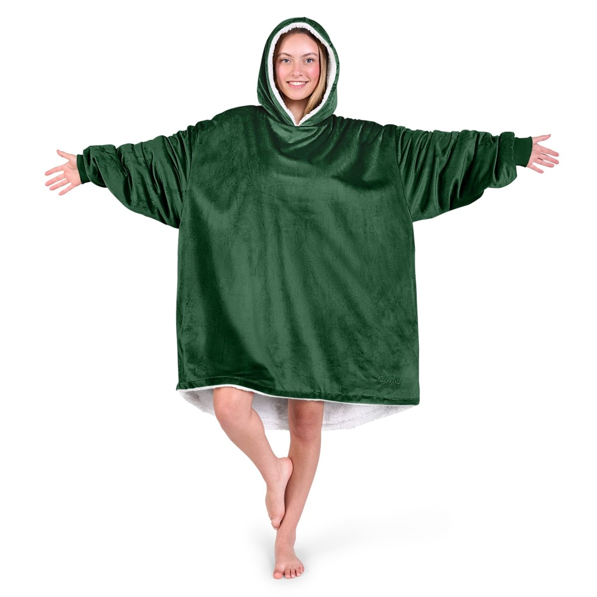 An adult with a hooded wearable blanket on