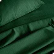 Close up of a heather sheet set on a bed