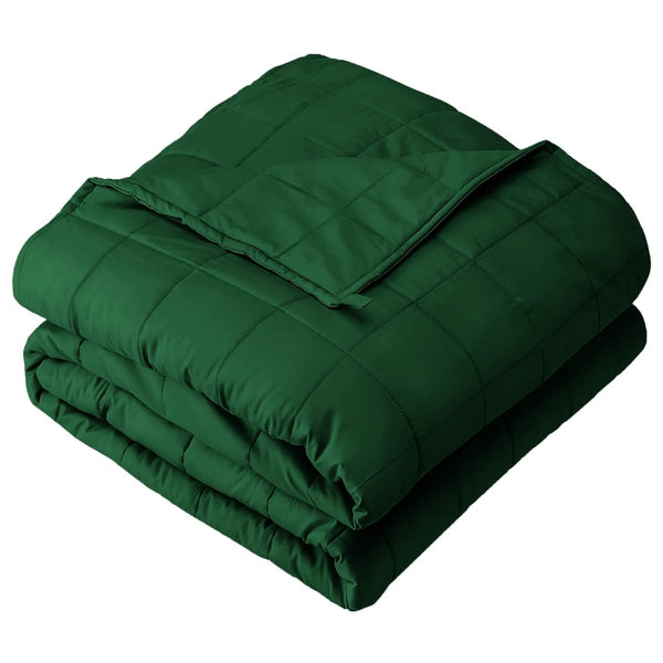 A folded cotton weighted blanket with a white background