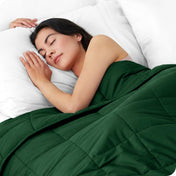 A woman sleeping with a weighted blanket over her body
