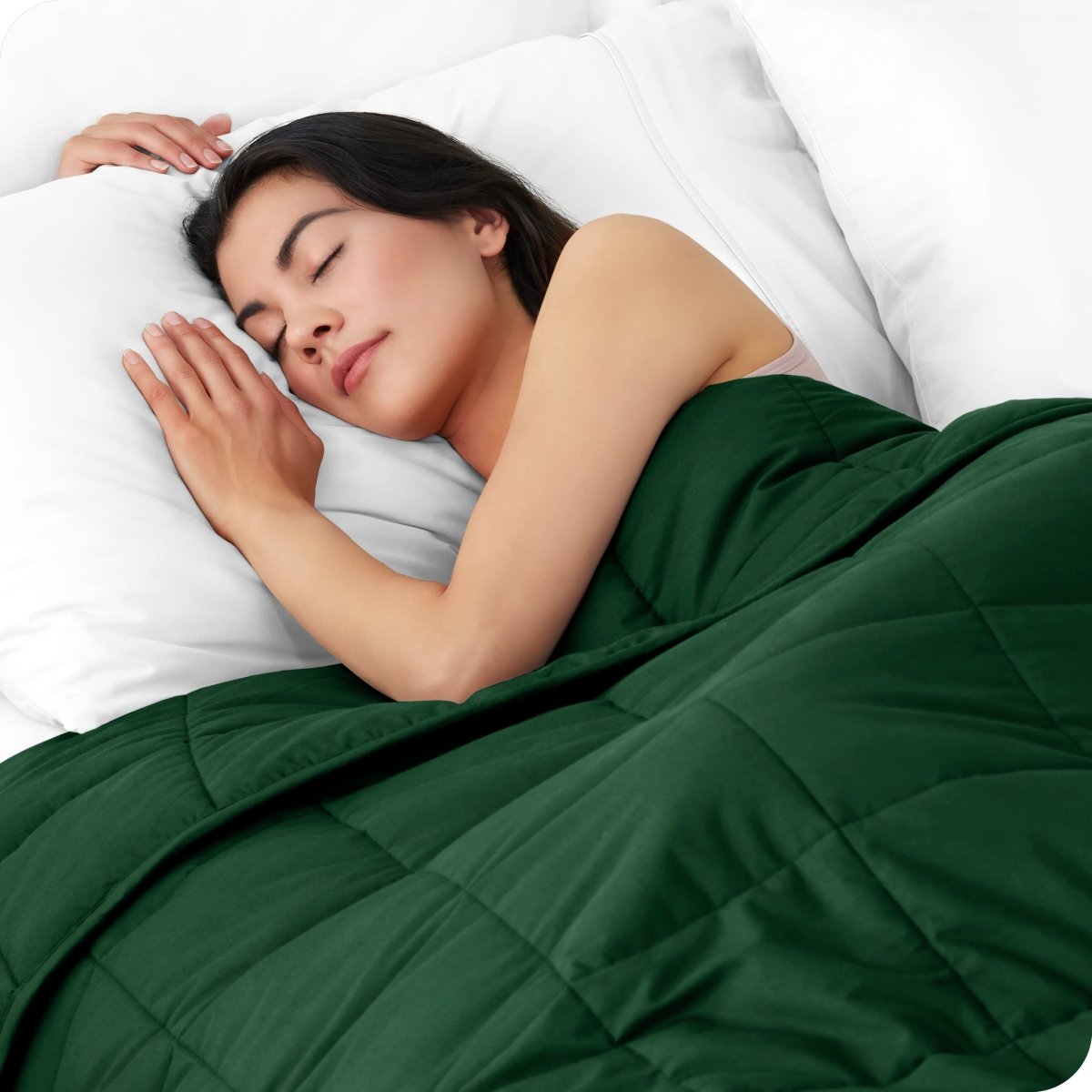 A woman sleeping with a weighted blanket over her body
