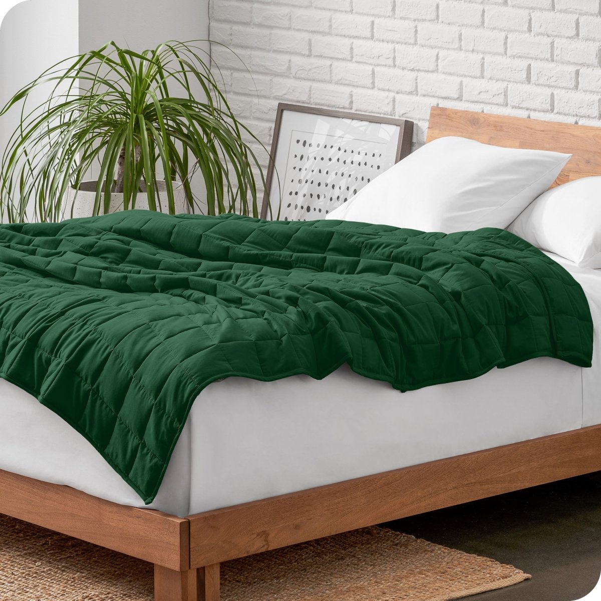 A weighted blanket draped over a bed