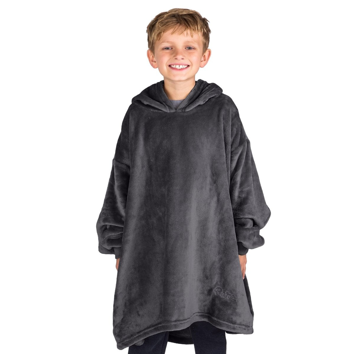 A boy dressed in a microplush wearable blanket.