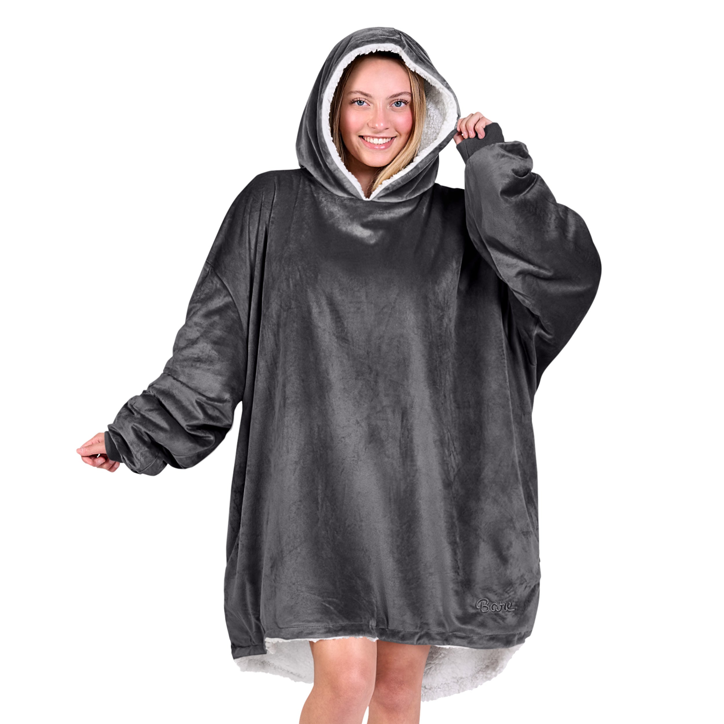 An adult with a sherpa wearable blanket on