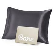 A grey mulberry silk pillowcase on a pillow