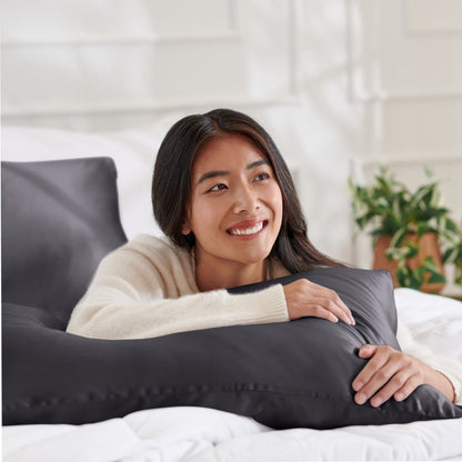 Woman lying on abed with a silk pillowcase