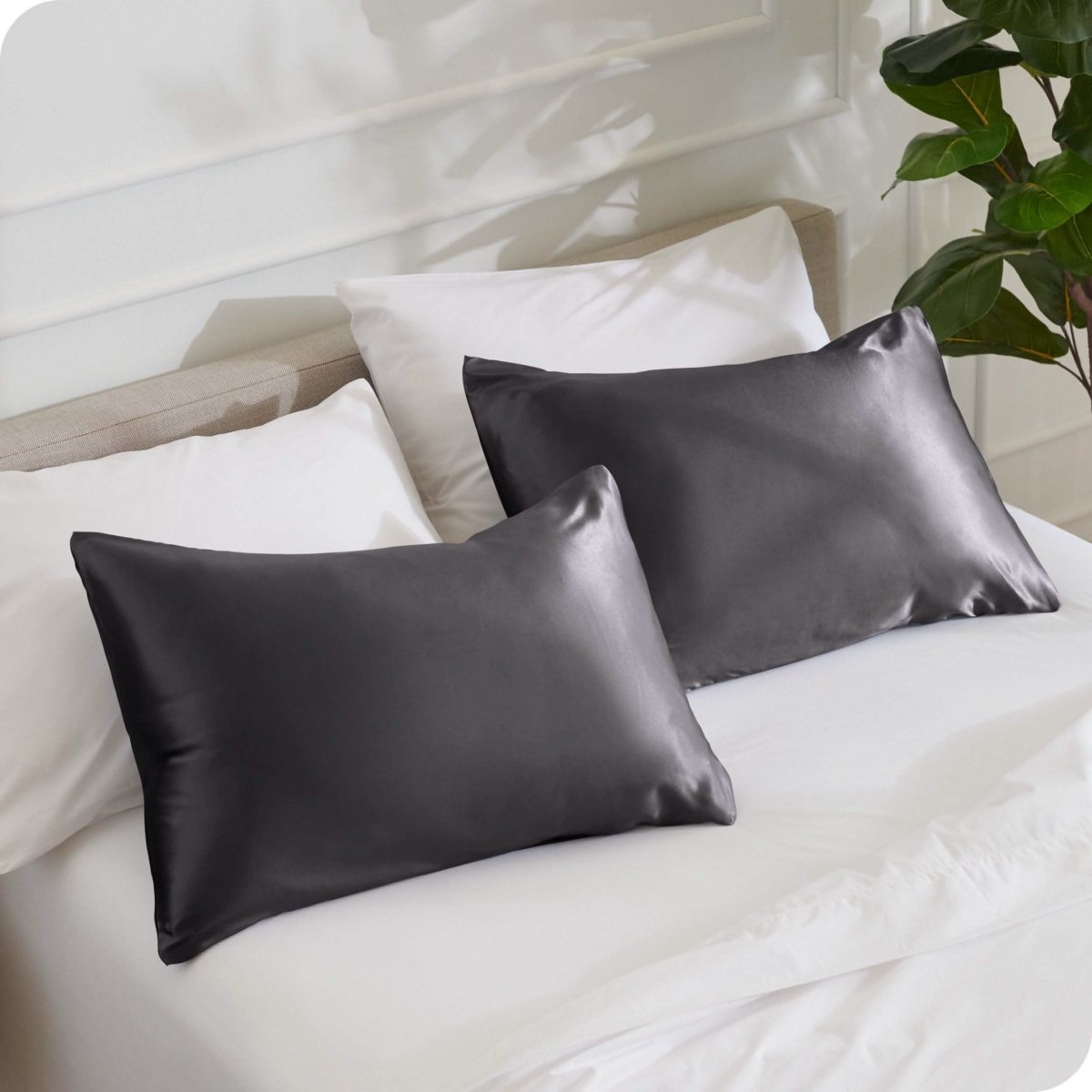 2 mulberry silk pillowcases on pillows set on a bed