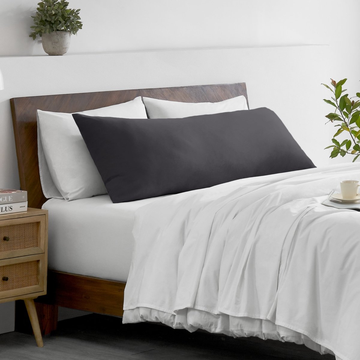 Bed with microfiber bedding and wooden headboard in a bedroom setting