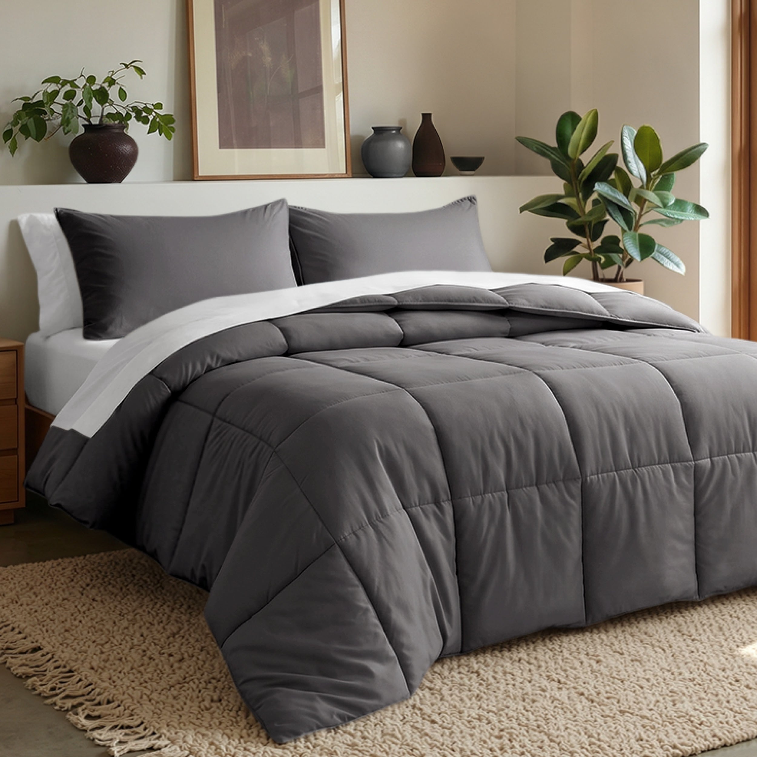 Comforter set on a bed in a bedroom with plants and decor.