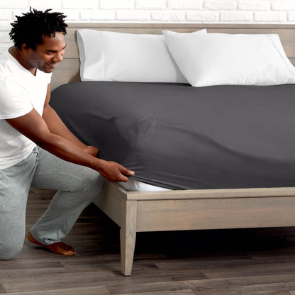 Ultra soft fitted sheet on a mattress with the sun shining into the bedroom