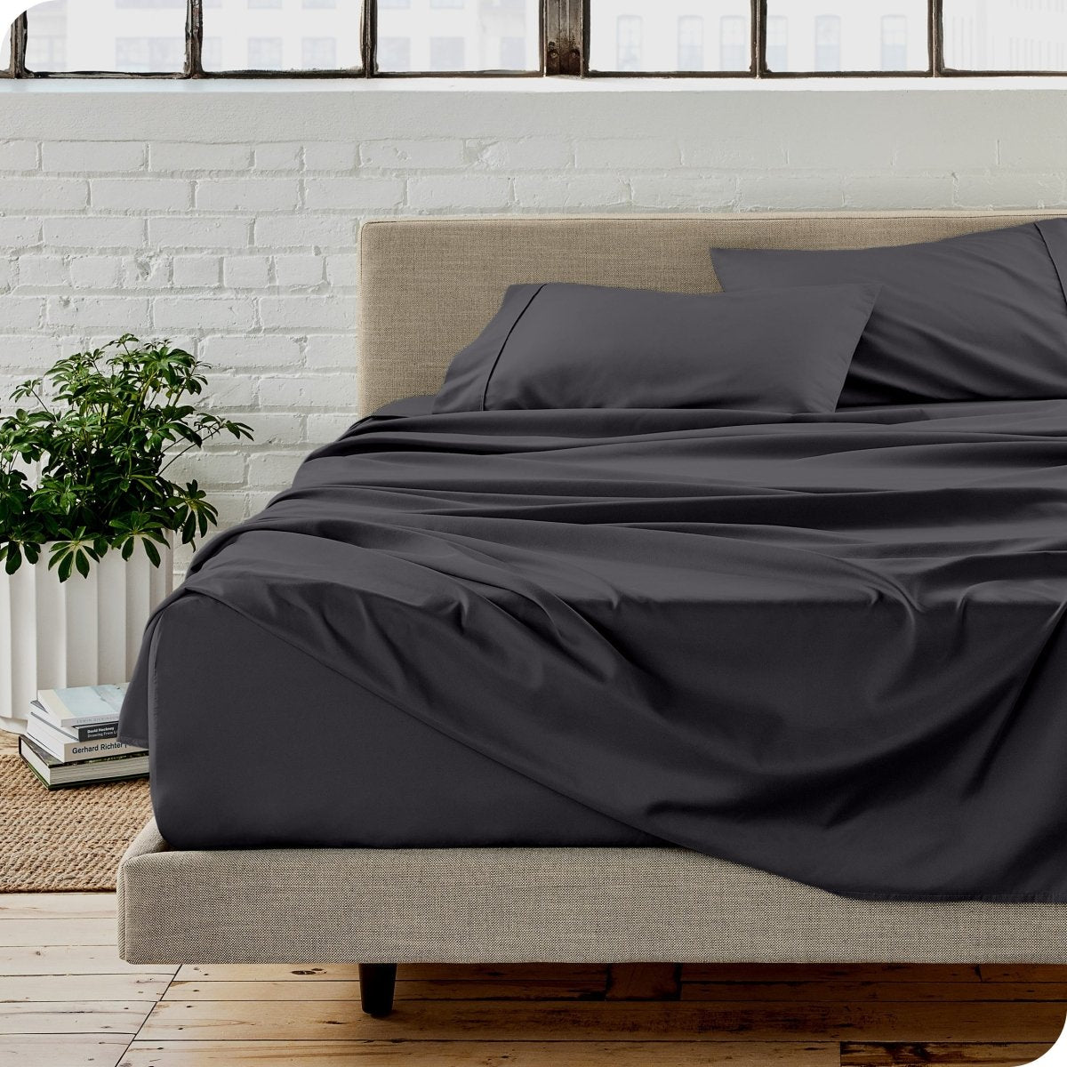 A modern bedroom with microfiber sheets on the mattress
