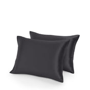 Two satin pillowcases on a white background