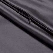 Close-up of poly satin pillowcase with a zipper
