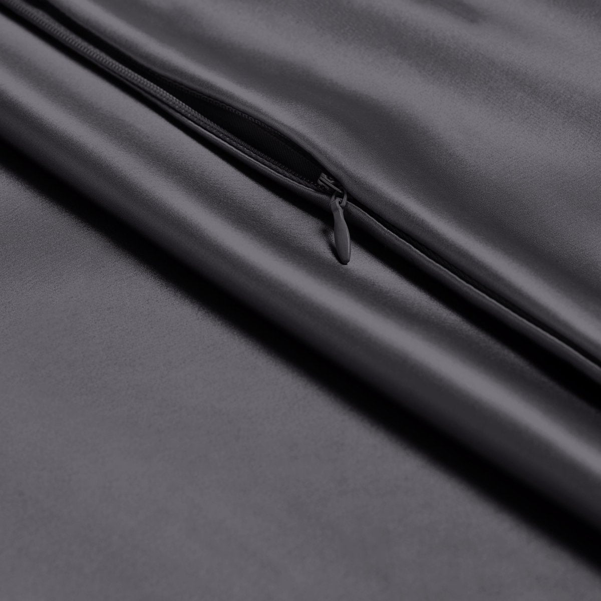 Close-up of poly satin pillowcase with a zipper