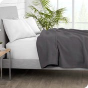 Polar fleece blanket on a bed