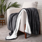 Blanket draped over a chair in a cozy living room setting.