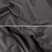 Close-up of duvet ties and button.