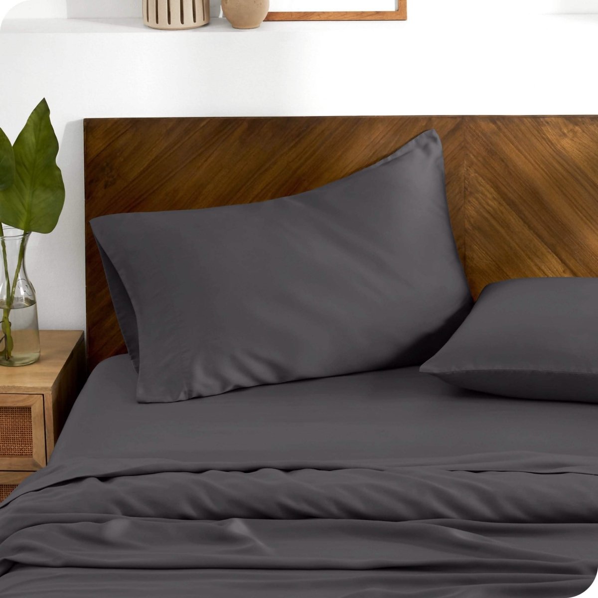 TENCEL™ pillowcases on pillows. One pillow is leaning against the headboard while the other is flat on the mattress.