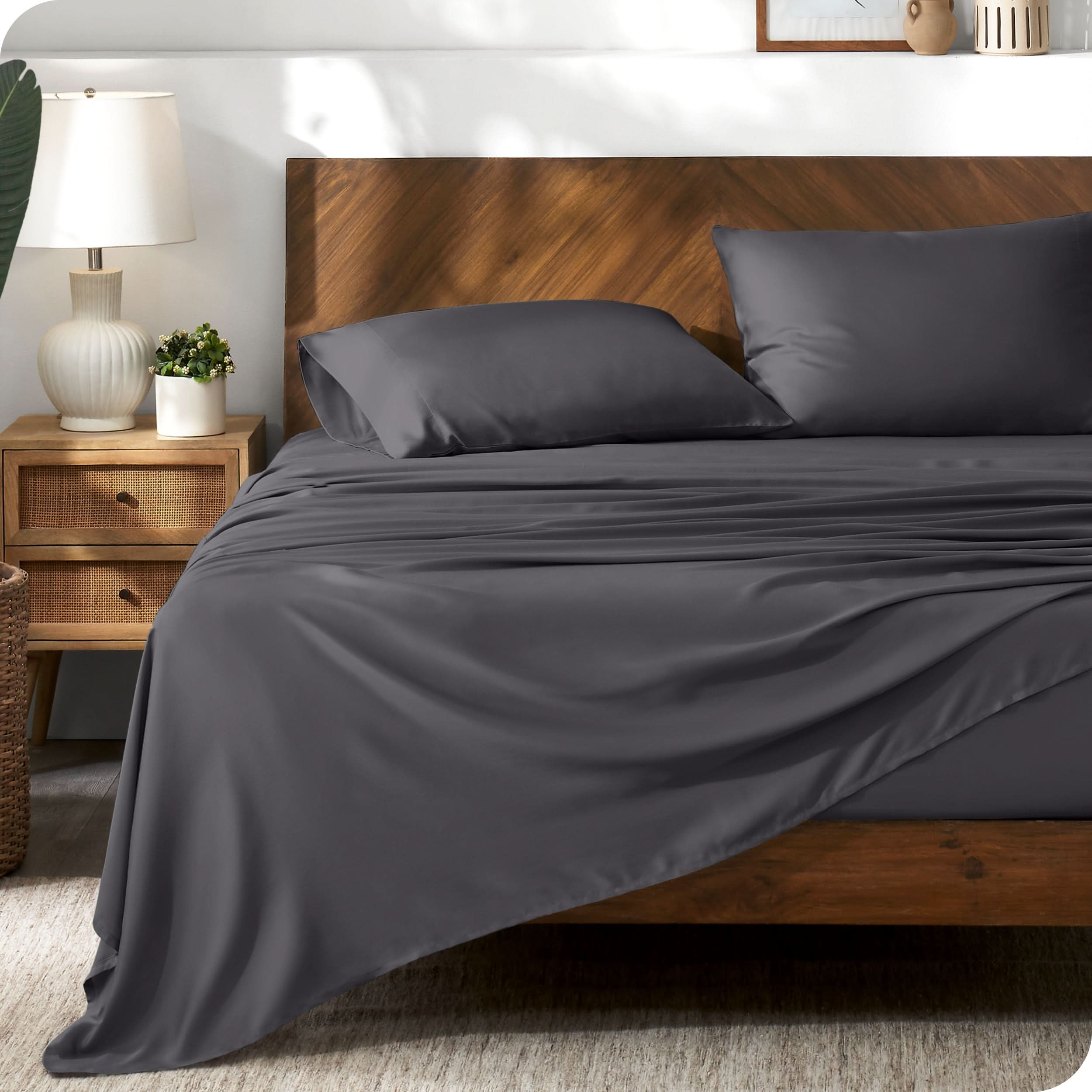 TENCEL™ sheet set on a bed. The flat sheet is draped over the side and end of the bed.