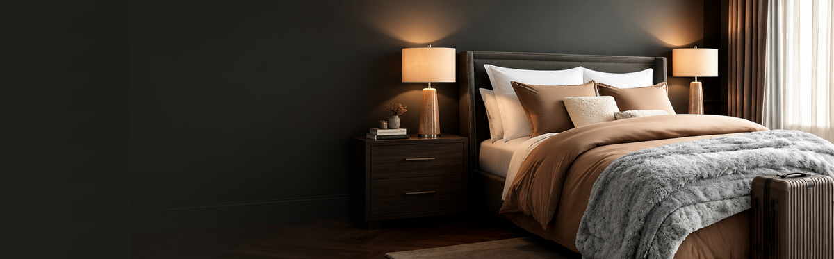 Dimly lit bedroom scene with a made bed