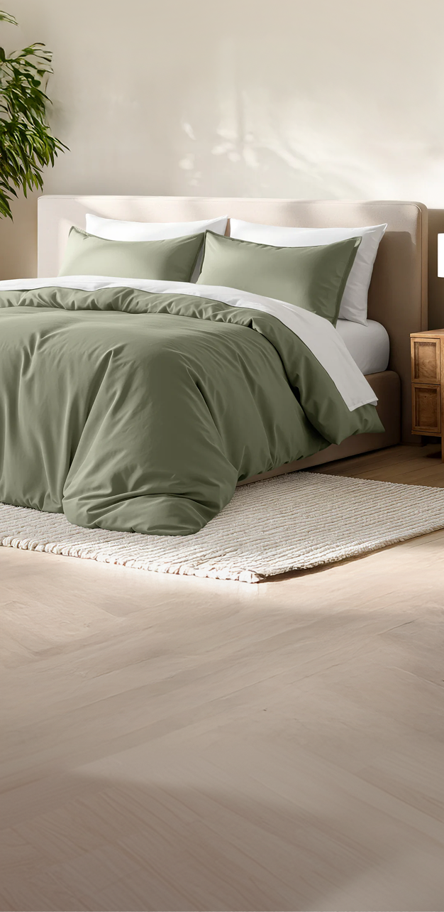 Close-up of white and gray bedding on a bed