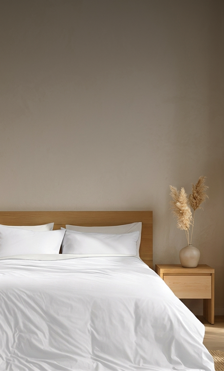 A bed made with all white bedding