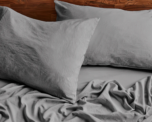 Close-up of a gray pillow and bedding
