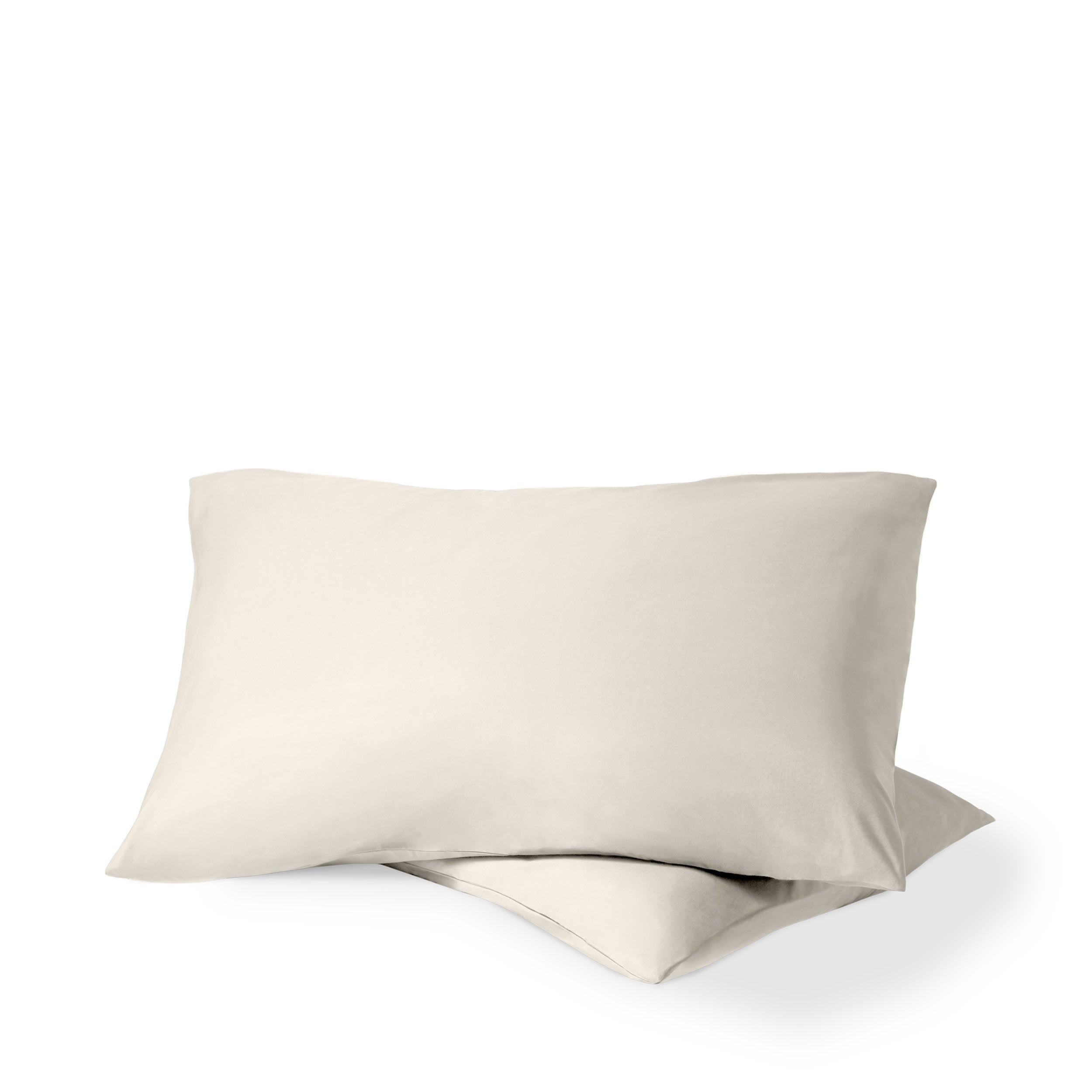 Two pillows with percale pillowcases on them