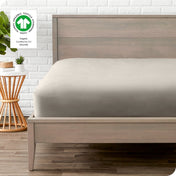 Modern wood bed frame with a sateen fitted sheet on the mattress