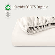 Certified GOTS Organic fitted sheet on a light gray background
