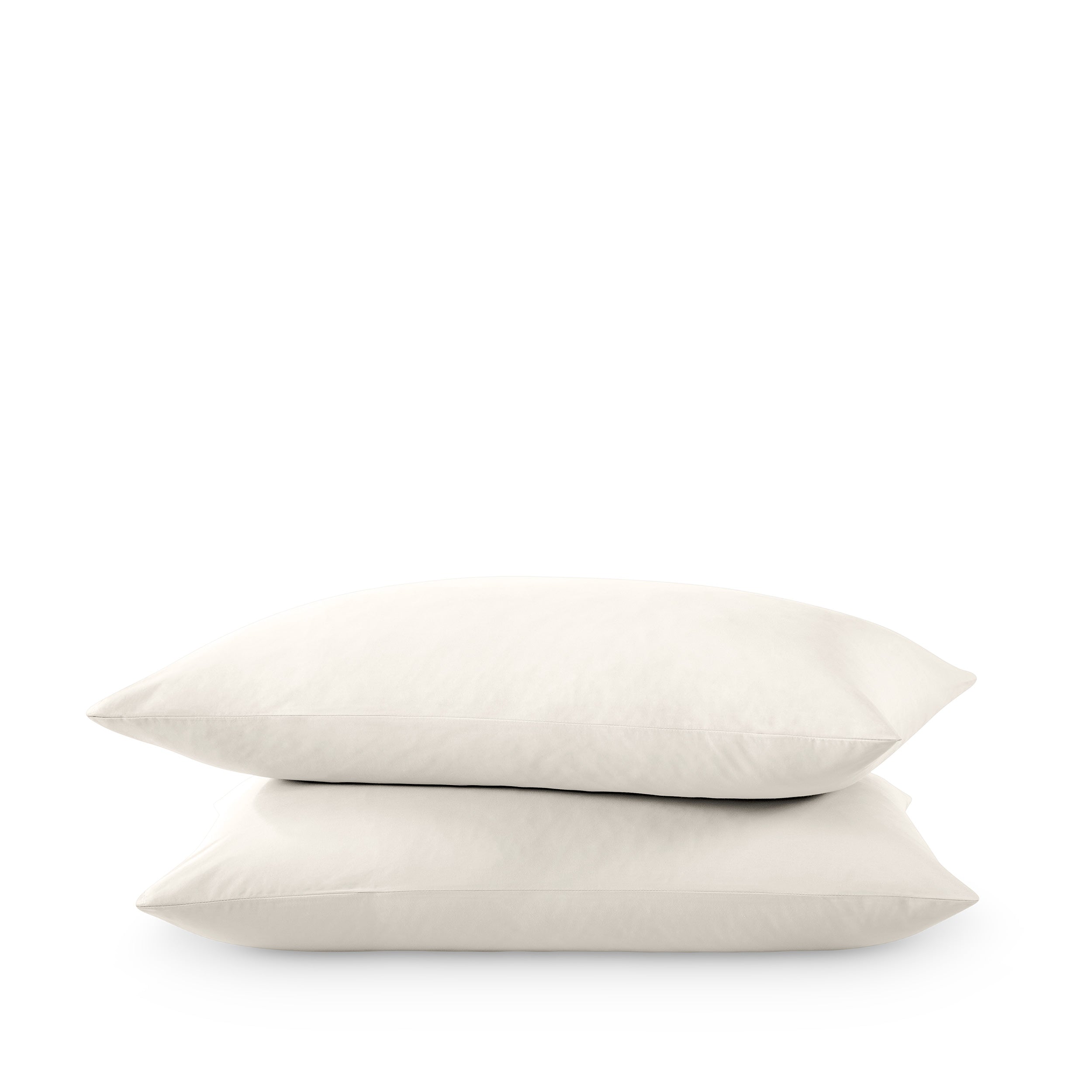 Two pillows stacked on a white background