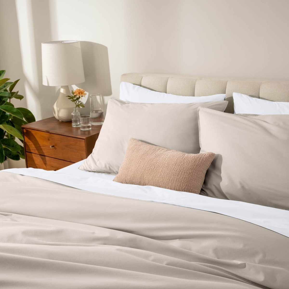 Bed with percale bedding in a bedroom setting