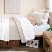Bed with percale bedding in a dorm room setting