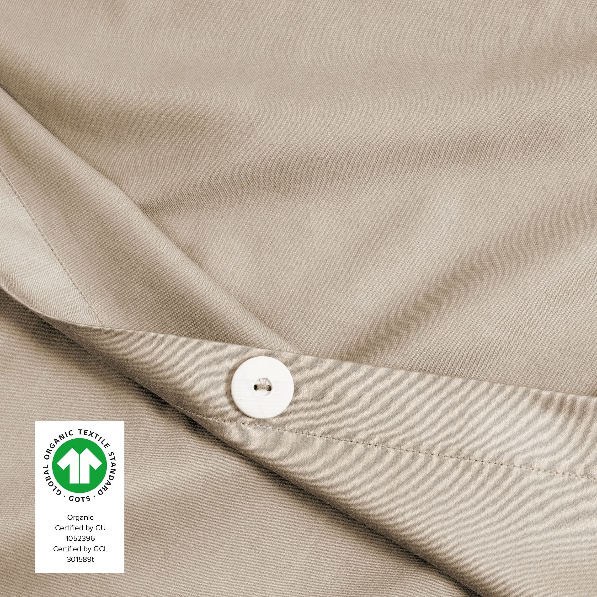 Close up of a button on the sateen duvet cover