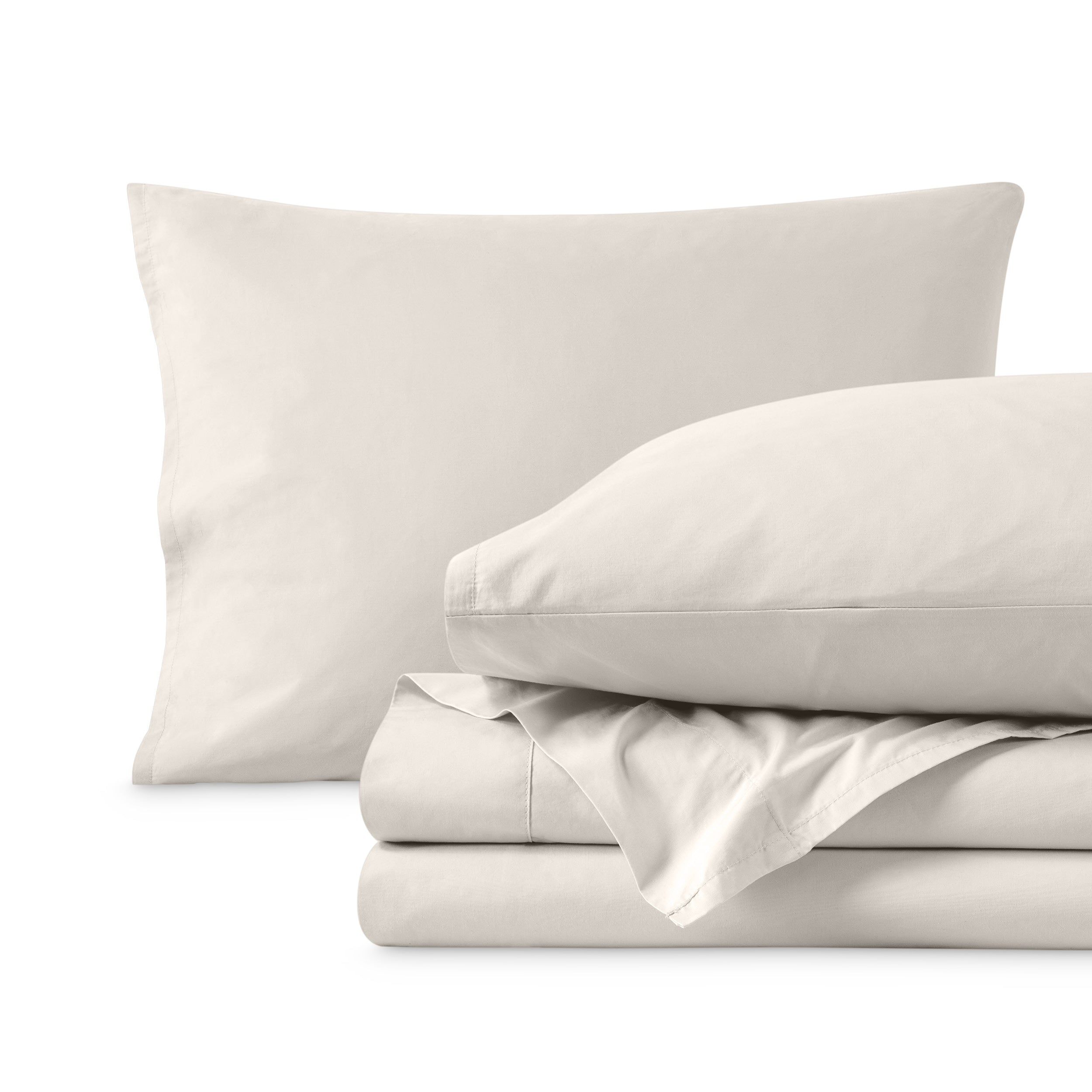 Percale sheets folded and matching pillowcases with pillows in them