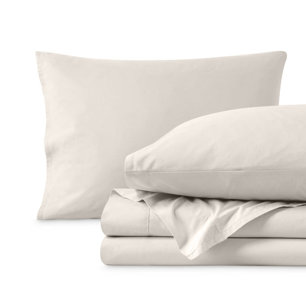 Percale sheets folded and matching pillowcases with pillows in them