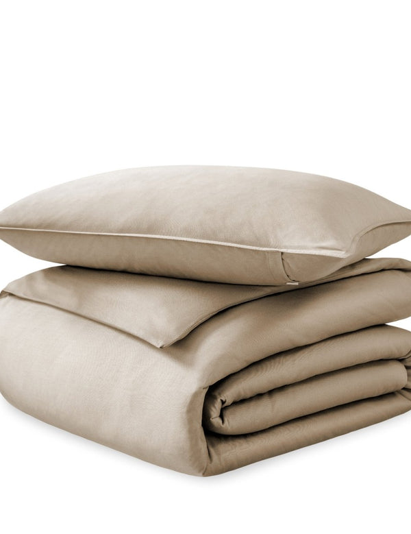 A sateen duvet set arranged in a stack