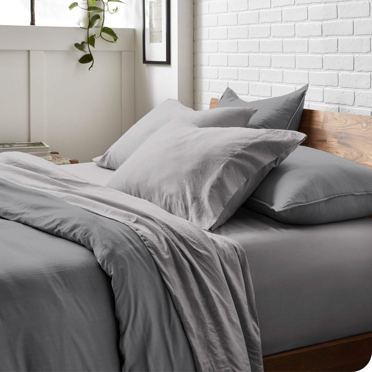 Modern bedroom with washed sheets and duvet cover on a bed